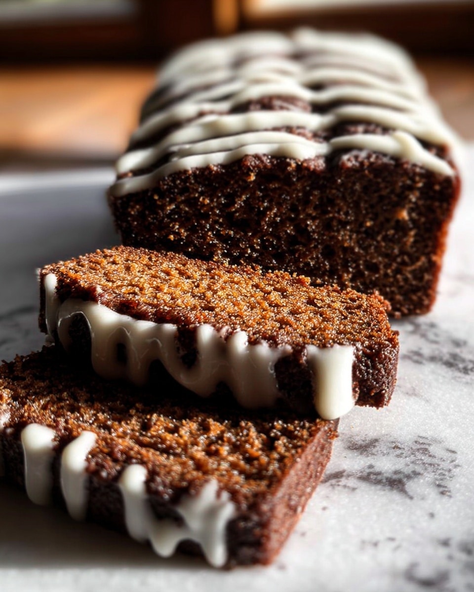 A close-up of a loaf cake with a rough texture, cut into several thick slices. The cake is dark brown and moist looking with a dense crumb. On top and slightly down the sides, thick white icing drips unevenly, creating a soft contrast with the cake’s dark surface. The cake is placed on a white marbled surface with soft natural light coming in from the side, highlighting the details of the texture and icing. Photo taken with an iphone --ar 4:5 --v 7
