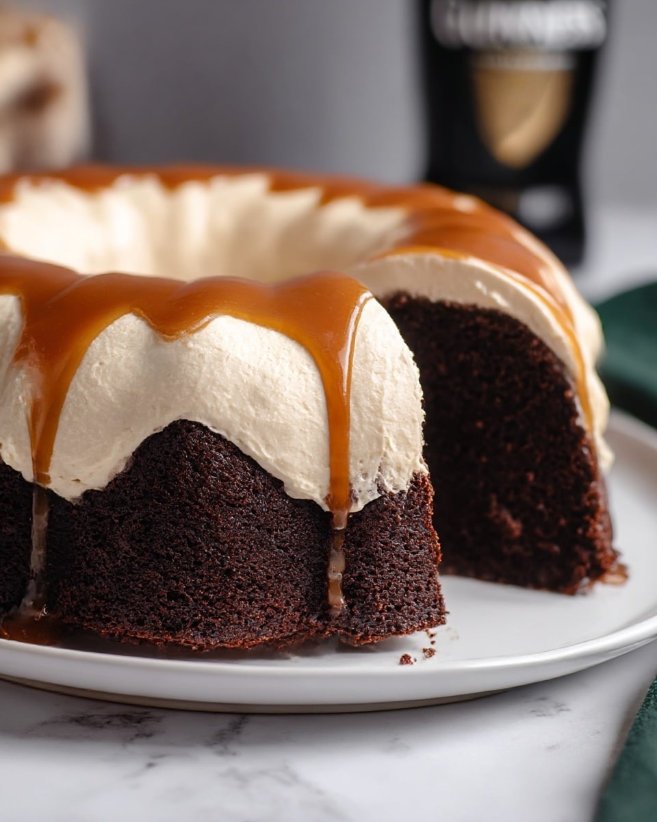 The image shows a moist dark chocolate cake in a bundt shape with three visible layers. The bottom layer is rich, dark brown cake with a soft texture, topped by a thick middle layer of smooth, creamy off-white frosting. The top layer is a shiny caramel sauce that drips slightly down the sides, adding a glossy amber color. The cake sits on a white plate, placed on a white marbled surface. In the background, a dark bottle is blurred out. Photo taken with an iphone --ar 4:5 --v 7